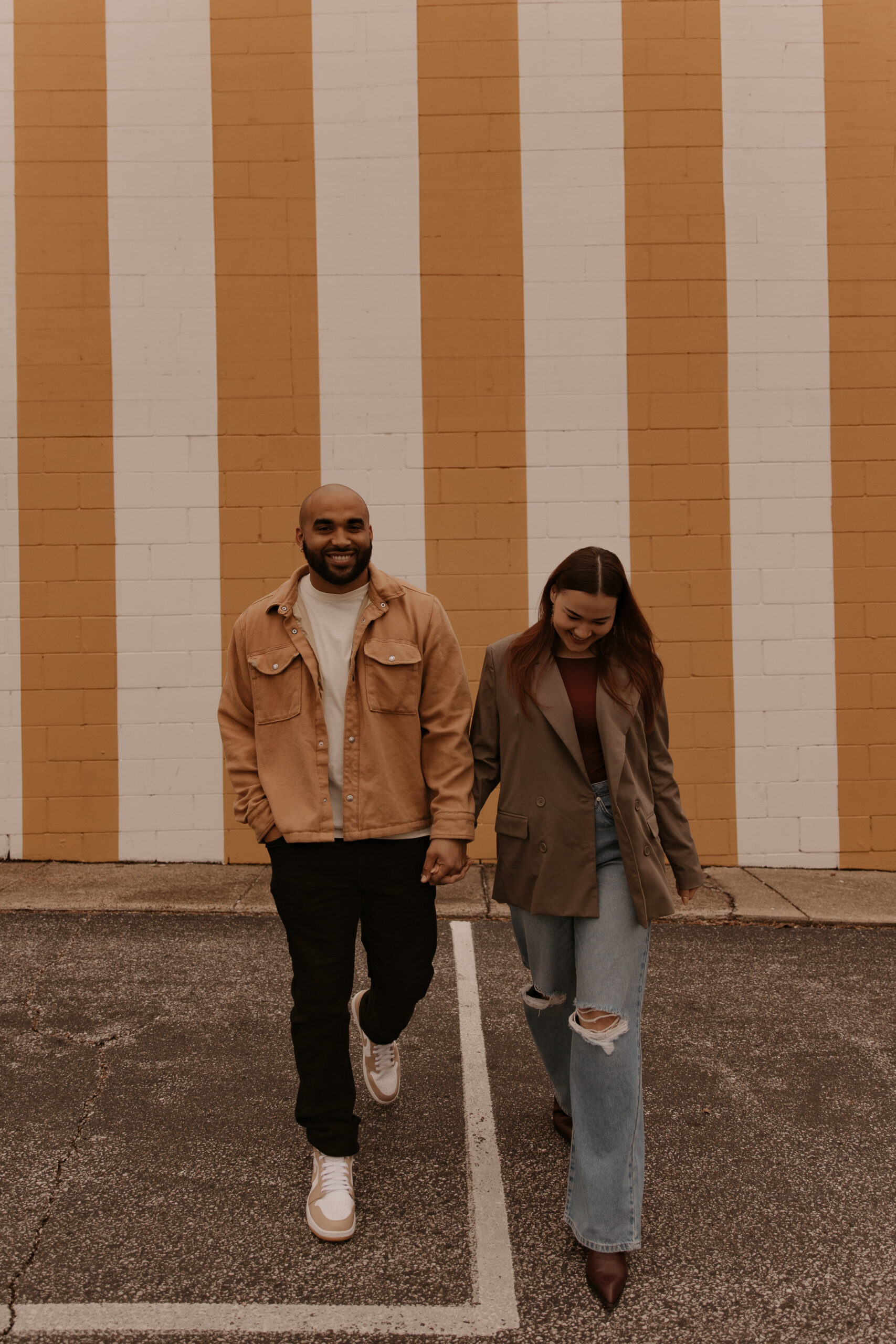Downtown Newburgh Indiana engagement photography couple walking